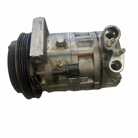 This is a used A/C compressor in good working condition, designed to deliver reliable performance. The compressor comes with a clutch and is ready for installation.