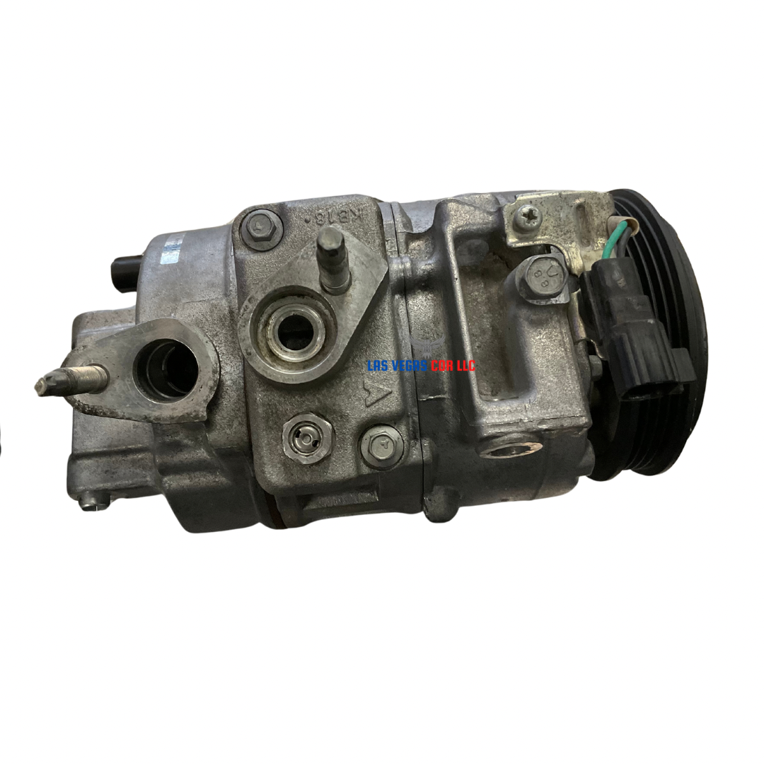 Used A/C compressor with clutch for a 2019 Lincoln MKZ Base 2.0L, showing all connection ports and mounting brackets.”